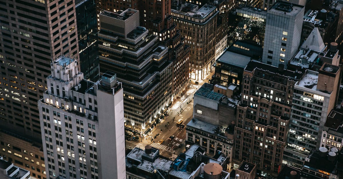 Minecraft: building a tower of arbitrary height from inside - Modern illuminated city district in evening Minecraft: building a tower of arbitrary height from inside - Modern illuminated city district in evening
