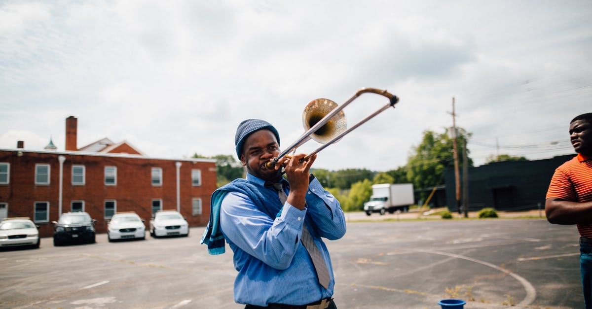 Minecraft Command Block "You must specify which player you wish to perform this action on." - Black male musicians with wind instrument performing song near parking