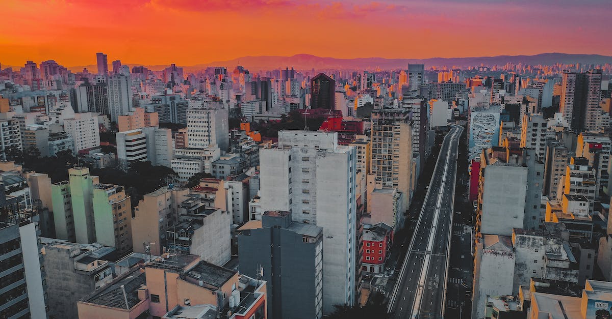 Minecraft Command Block Remote Volume Selection - Aerial view of residential multistory buildings of living district near straight asphalt road under colorful sundown sky Minecraft Command Block Remote Volume Selection - Aerial view of residential multistory buildings of living district near straight asphalt road under colorful sundown sky