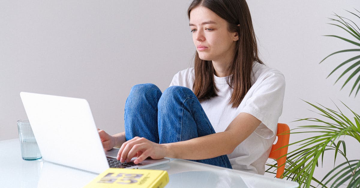 Minecraft commands aren't working for me - Woman in White Crew Neck T-shirt and Blue Denim Jeans Working on a Laptop
