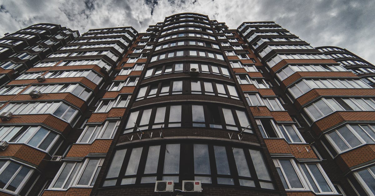 Minecraft cutting out large area with command blocks - Tall building located against cloudy sky