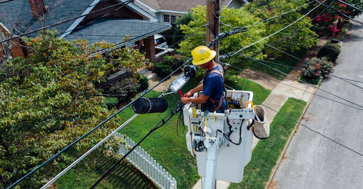 Minecraft: Does anyone know of a working config for ftb utilities specificly the badges - Photography of Man Repairing Electrical Wires