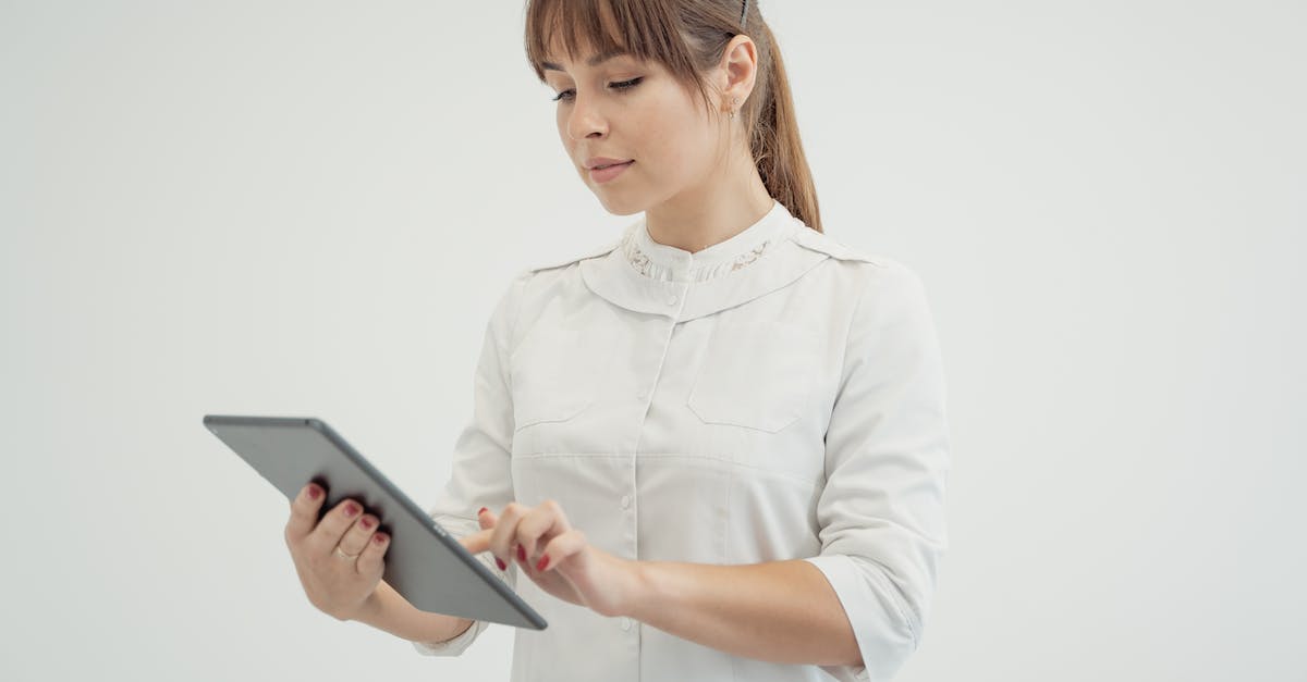 Minecraft for iPads - Woman in White Dress Shirt Holding Black Tablet Computer Minecraft for iPads - Woman in White Dress Shirt Holding Black Tablet Computer