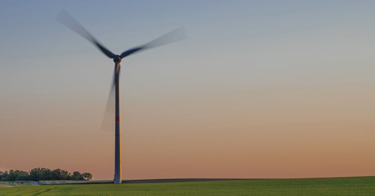 Minecraft FTB - Harvester Will Not Power On - Windmill in green agricultural field in evening