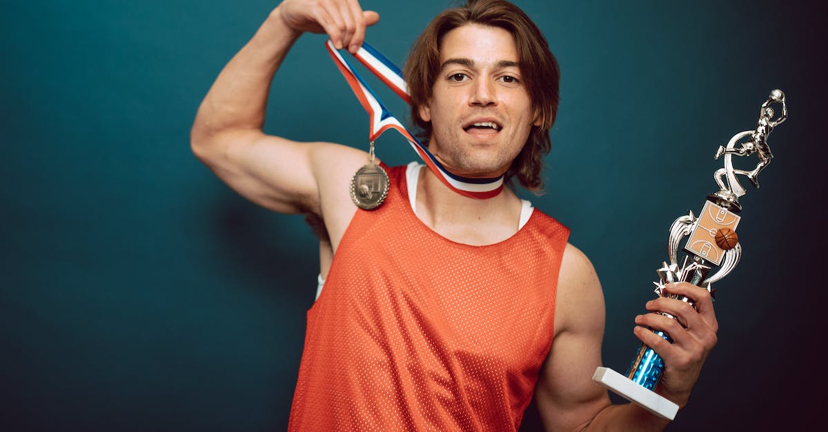 Minecraft how to testfor if a mob is looking at the player - A Basketball Player Posing with a Medal and a Trophy Minecraft how to testfor if a mob is looking at the player - A Basketball Player Posing with a Medal and a Trophy