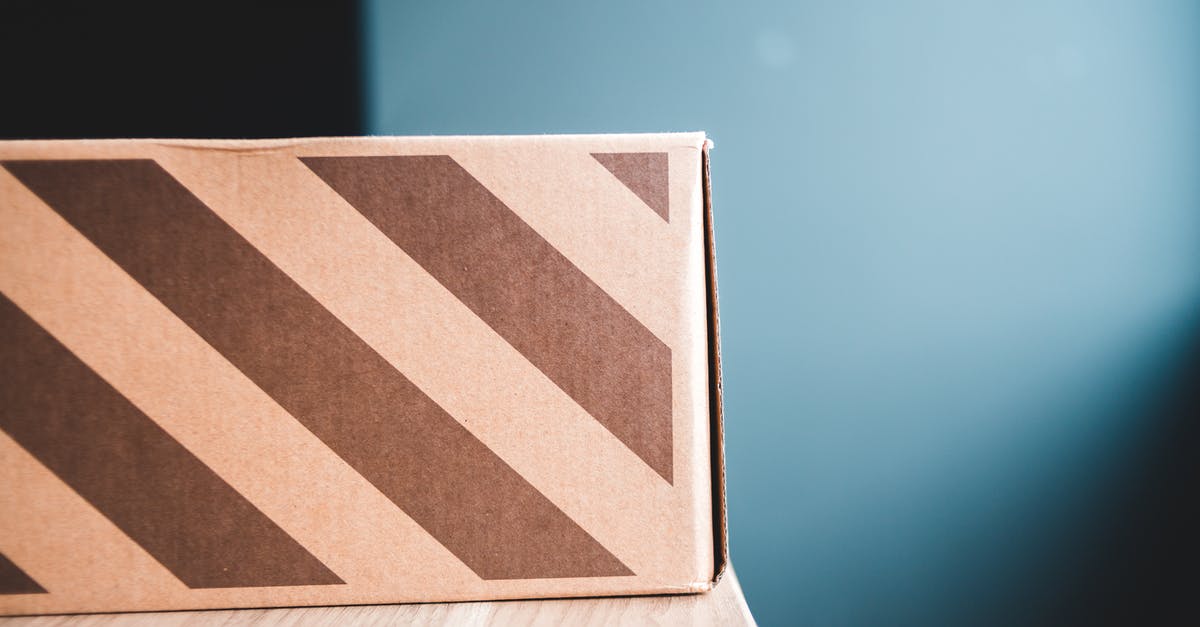 minecraft launcher wont open said that it was moved asks:if you whant to delete this shortcut [closed] - Closeup of carton box with stripes on wooden table against gray wall in apartment