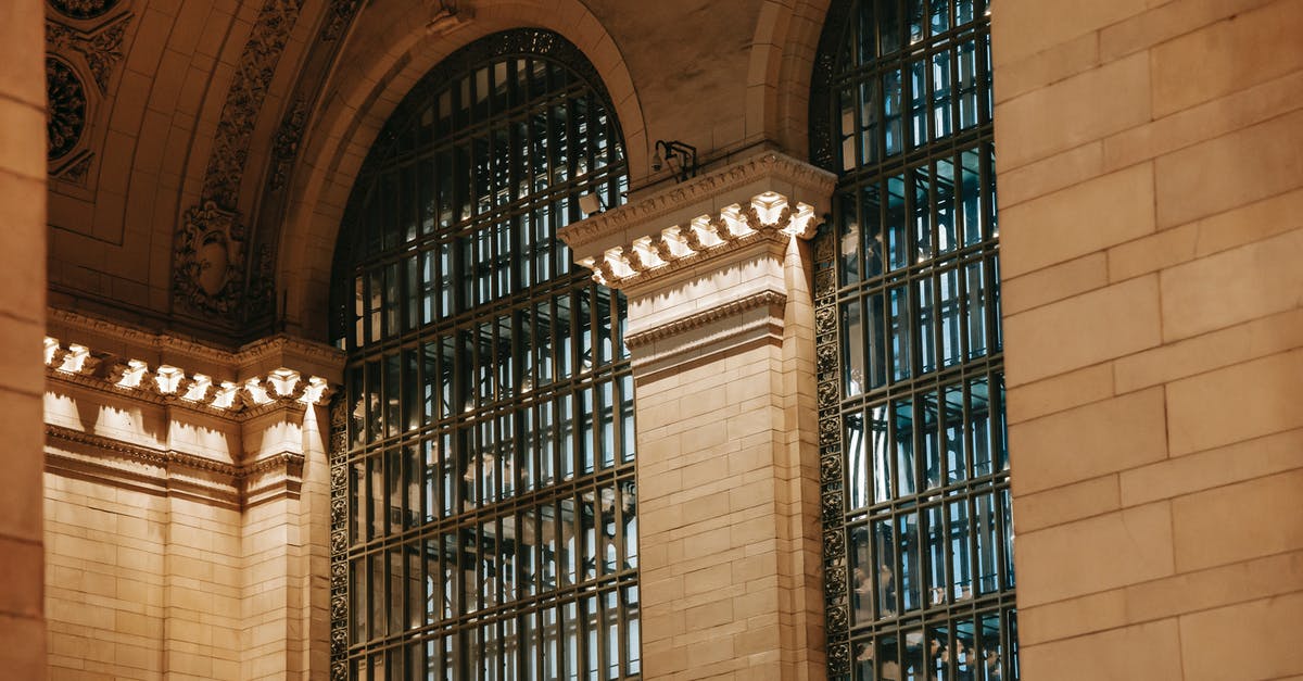 Minecraft lightning strike inside building - From below of illuminated interior of Grand Central Terminal station with high decorated ceiling and big windows with pillars in New York USA