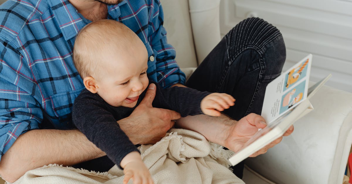 Minecraft limit to book reading - Man in Blue and Black Plaid Dress Shirt Holding Baby in White Onesie