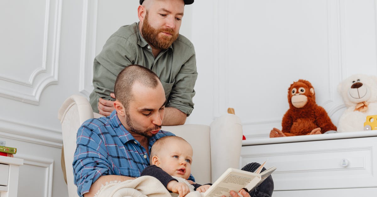 Minecraft limit to book reading - Man in Green Button Up Shirt Holding Baby in Blue and White Stripe Onesie Minecraft limit to book reading - Man in Green Button Up Shirt Holding Baby in Blue and White Stripe Onesie