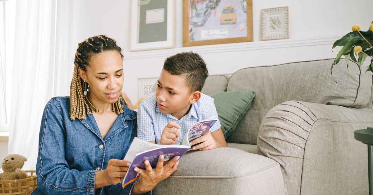 Minecraft limit to book reading - Woman in Blue Denim Jacket Sitting on Gray Couch Minecraft limit to book reading - Woman in Blue Denim Jacket Sitting on Gray Couch