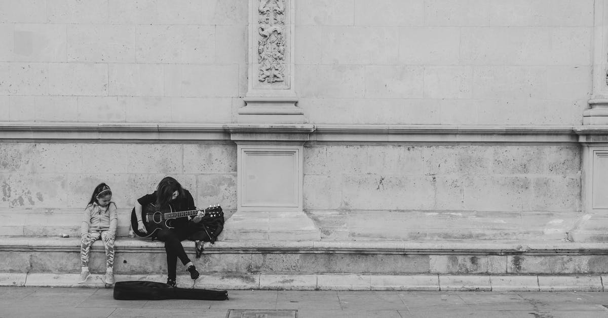 Minecraft Music never plays - Man Playing Guitar Sitting on Concrete Bench