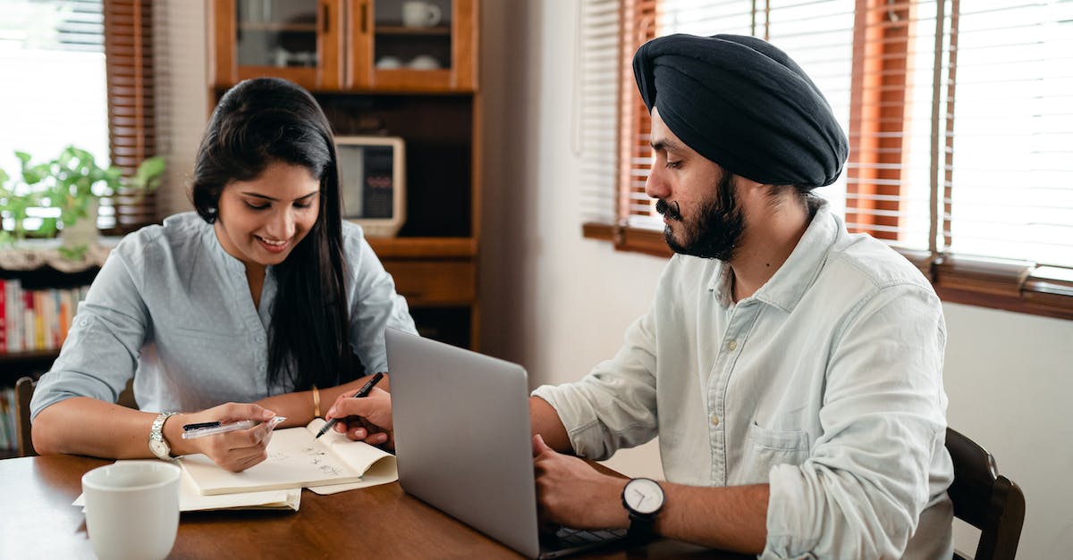 Minecraft server startup help - Smiling spouses discussing business plan at home