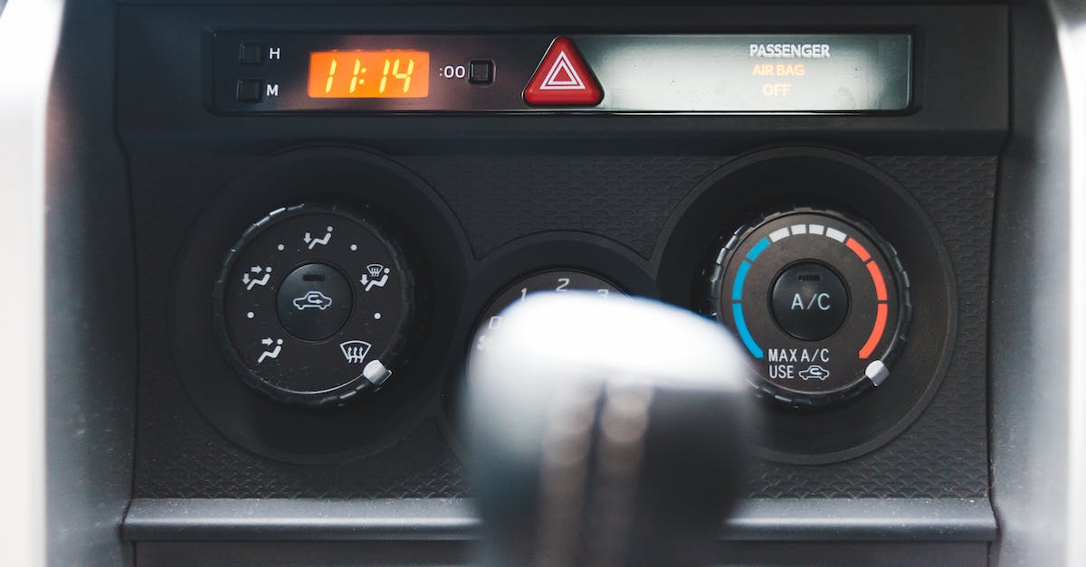 Minecraft server time to the end of the system - Blurred gear shift against dashboard with buttons and electronic clock in car in daytime