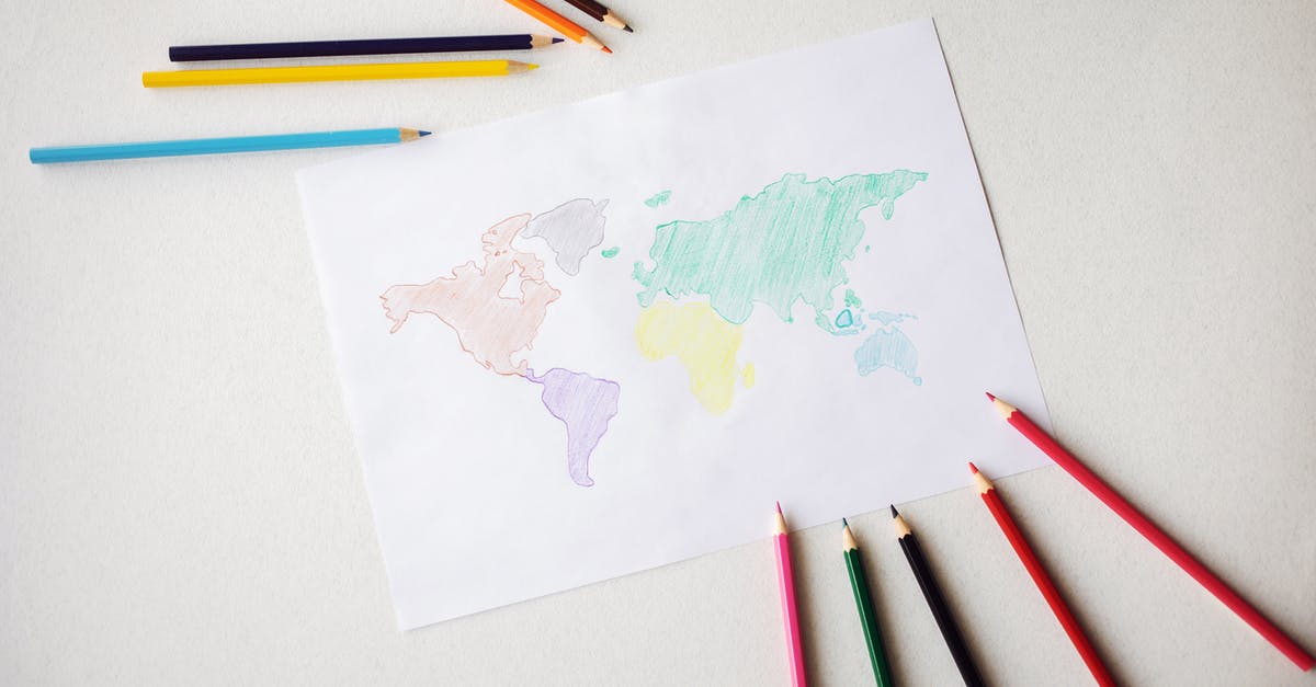 Minecraft SMP randomly teleporting to a set location - World map drawn on paper sheet near colorful pencils