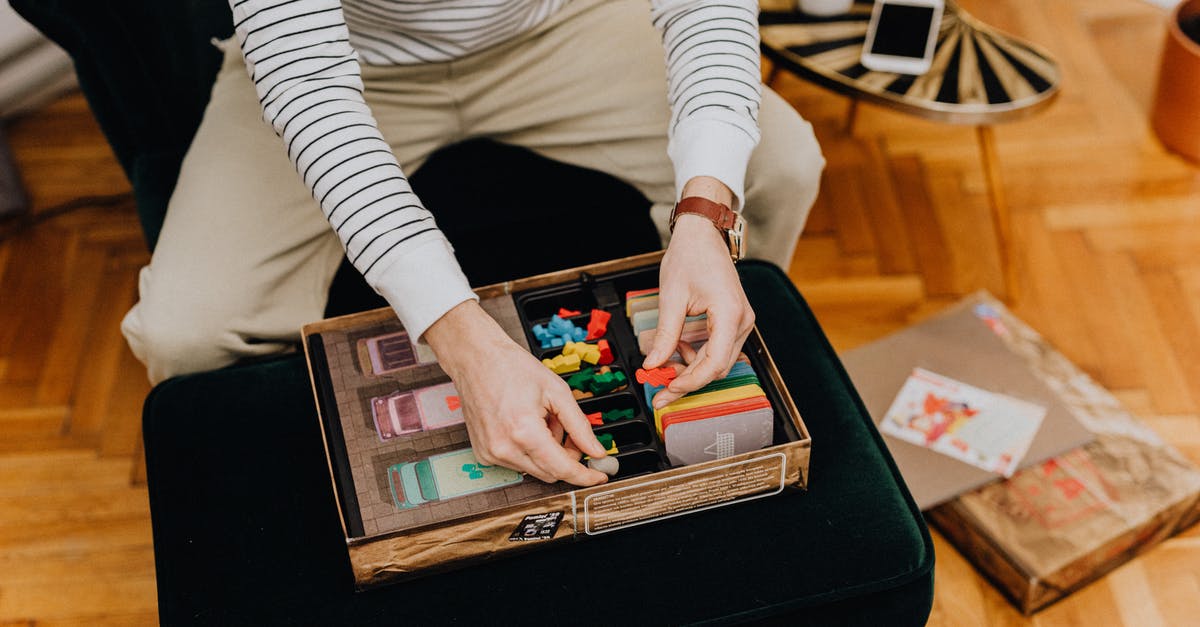 Minecraft stops playing [closed] - Man Sitting on Chair Playing Board Game