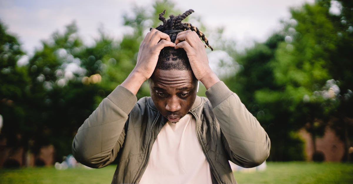 Minecraft Update Dilemma - Upset young African American male freelancer clutching head with hands after failure in project while working remotely in park Minecraft Update Dilemma - Upset young African American male freelancer clutching head with hands after failure in project while working remotely in park