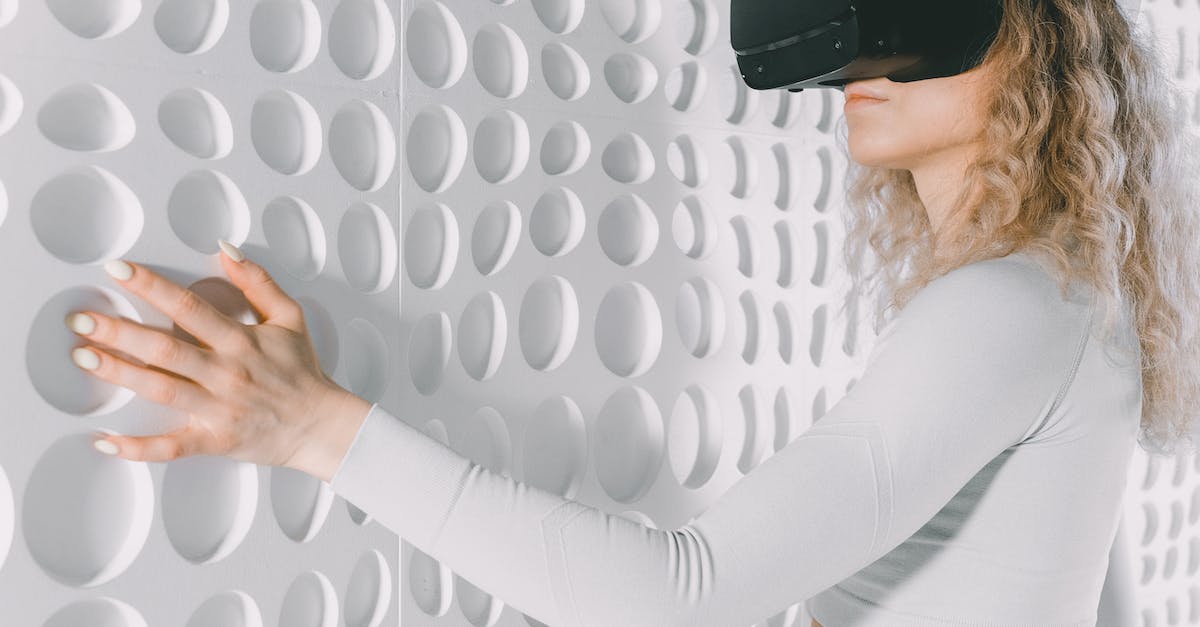 Minecraft worlds - Woman with a Virtual Reality Headset With a Hand on the Wall Minecraft worlds - Woman with a Virtual Reality Headset With a Hand on the Wall