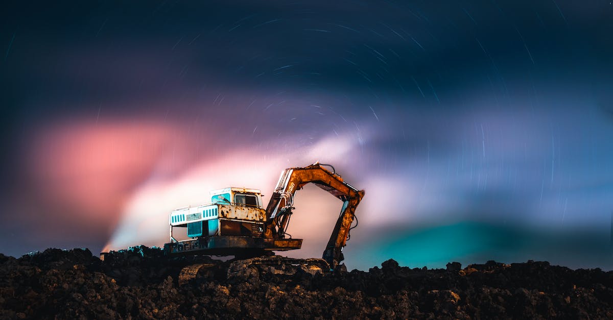 Mining at night - is there a difference? - Machinery Digging Ground during Northern Lights