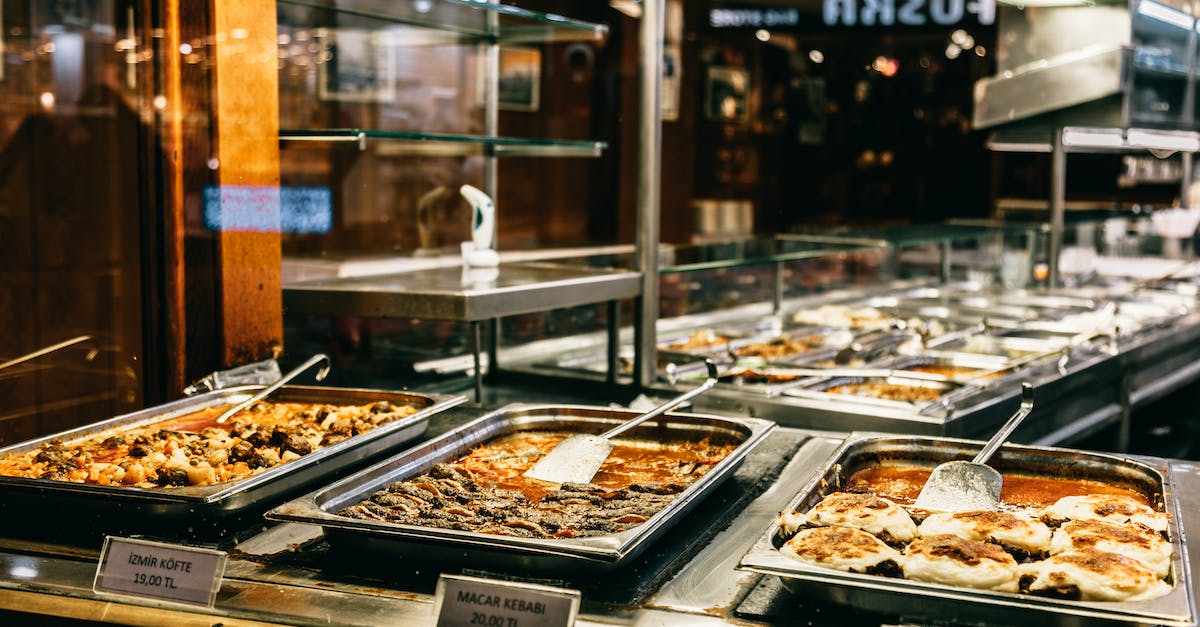 Mining at night - is there a difference? - Different hot dishes in big bowls selling in self service restaurant at night