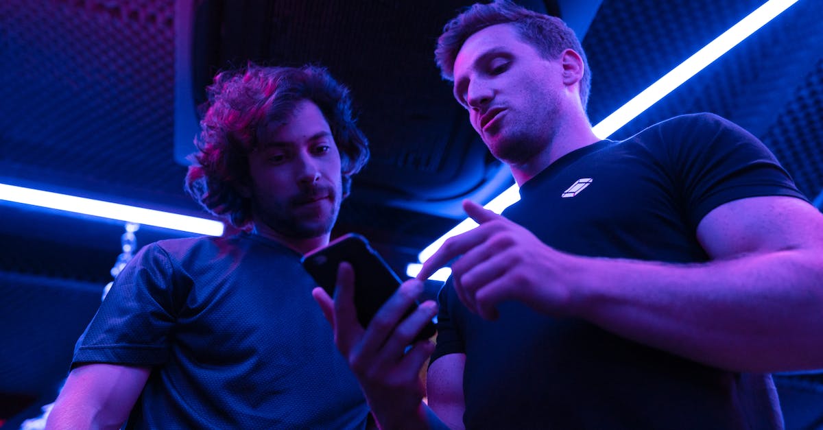 Missing 'Trackify' App When Looking For 'Lost Submarine' Parts - Men Looking at Smartphone Missing 'Trackify' App When Looking For 'Lost Submarine' Parts - Men Looking at Smartphone