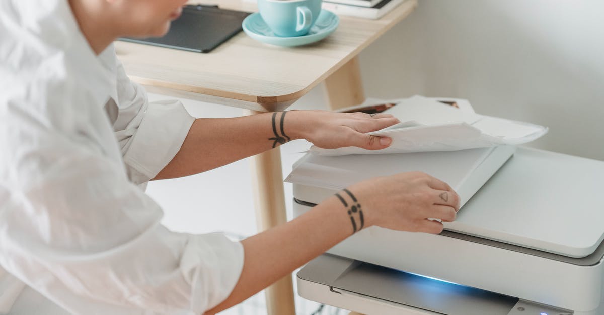 Missing fusion cores - how does the Gatling Laser work in regards to fusion cores? - From above of crop female worker taking sheets of paper for laser printing during remote work