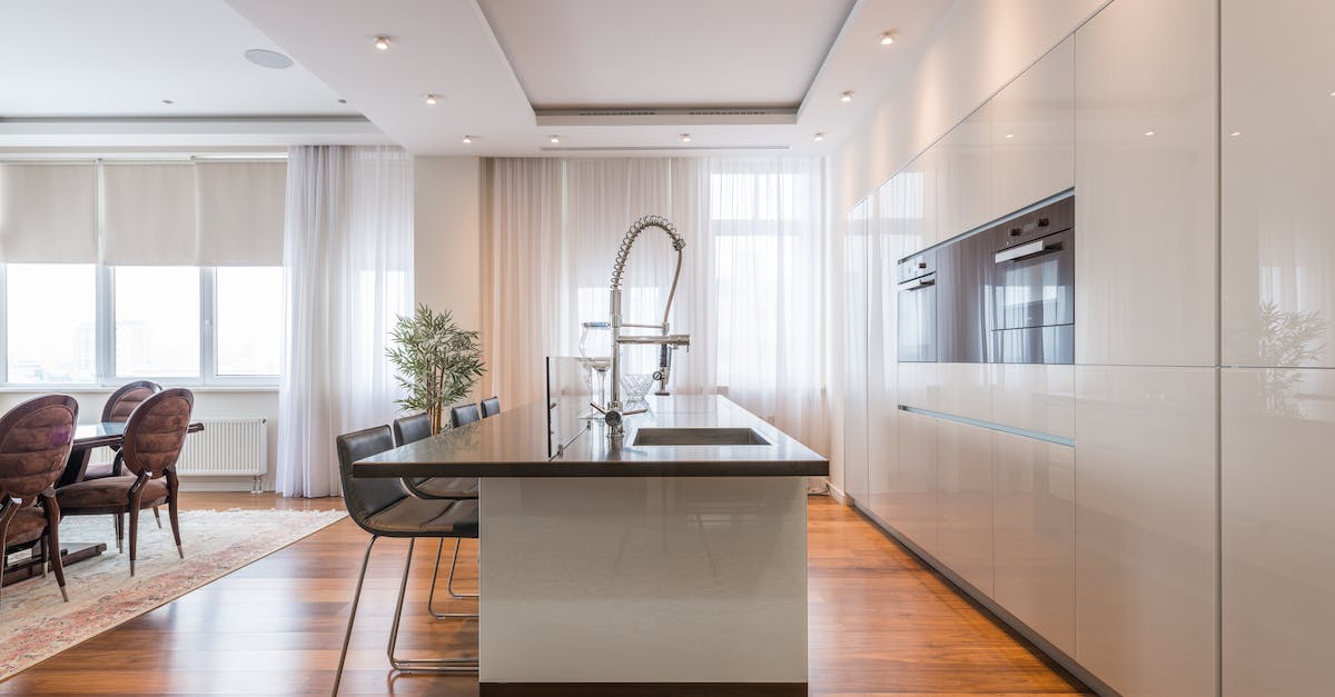 Missing Stars in Yoshi's New Island 1-2 - Interior of spacious kitchen with modern minimalist furniture with built in appliances and dining zone in contemporary apartment in daylight