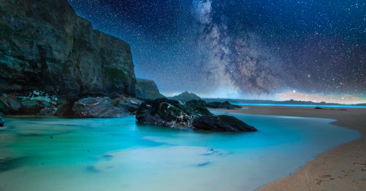 Missing Stars in Yoshi's New Island 1-2 - Ocean With Rock Formation Under Starry Night