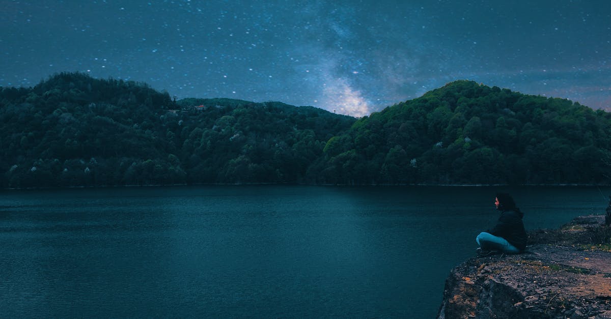 Missing Stars in Yoshi's New Island 1-2 - Woman Sitting on Peak Front of Calm Water at Night