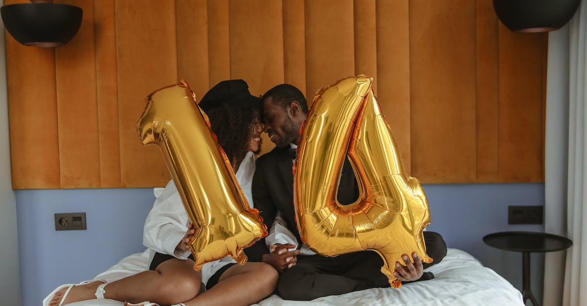 Momentum in rematch in NHL 14 - A Couple Sitting on the Bed While Holding a Number Balloon