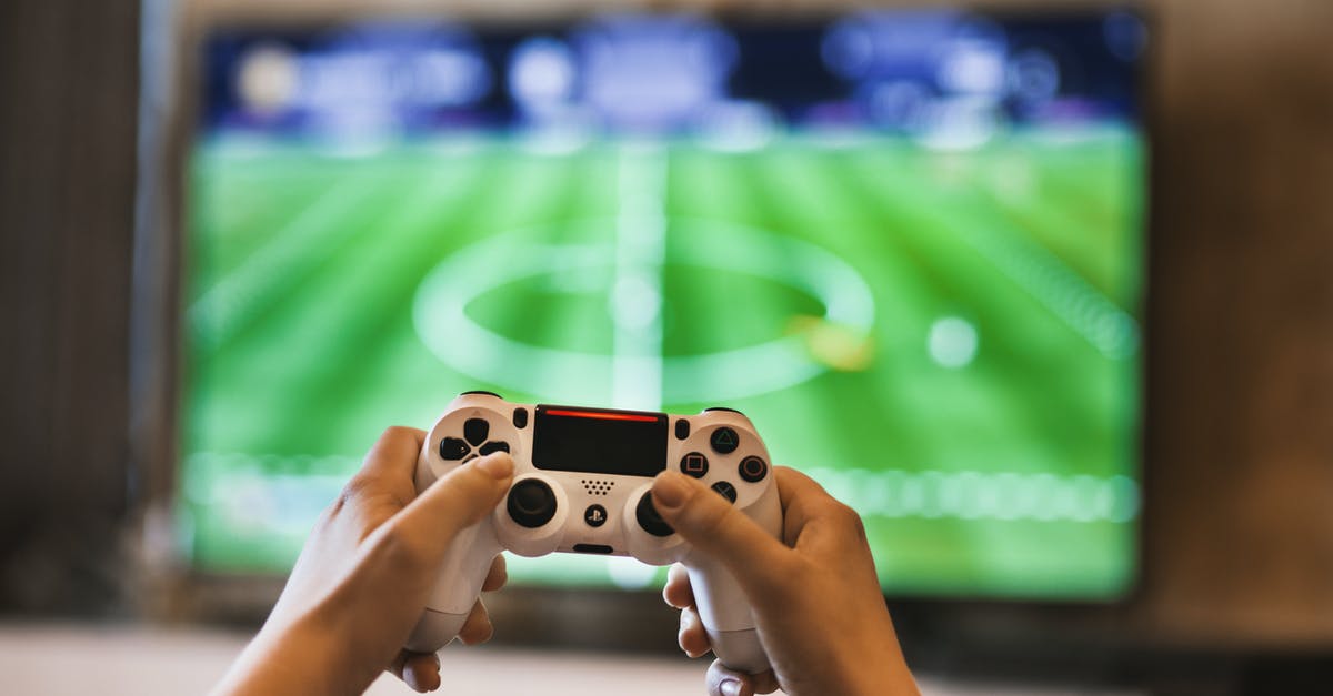 Monthly free games same as ones received as PS4 collection - Person Holding Game Pad Monthly free games same as ones received as PS4 collection - Person Holding Game Pad