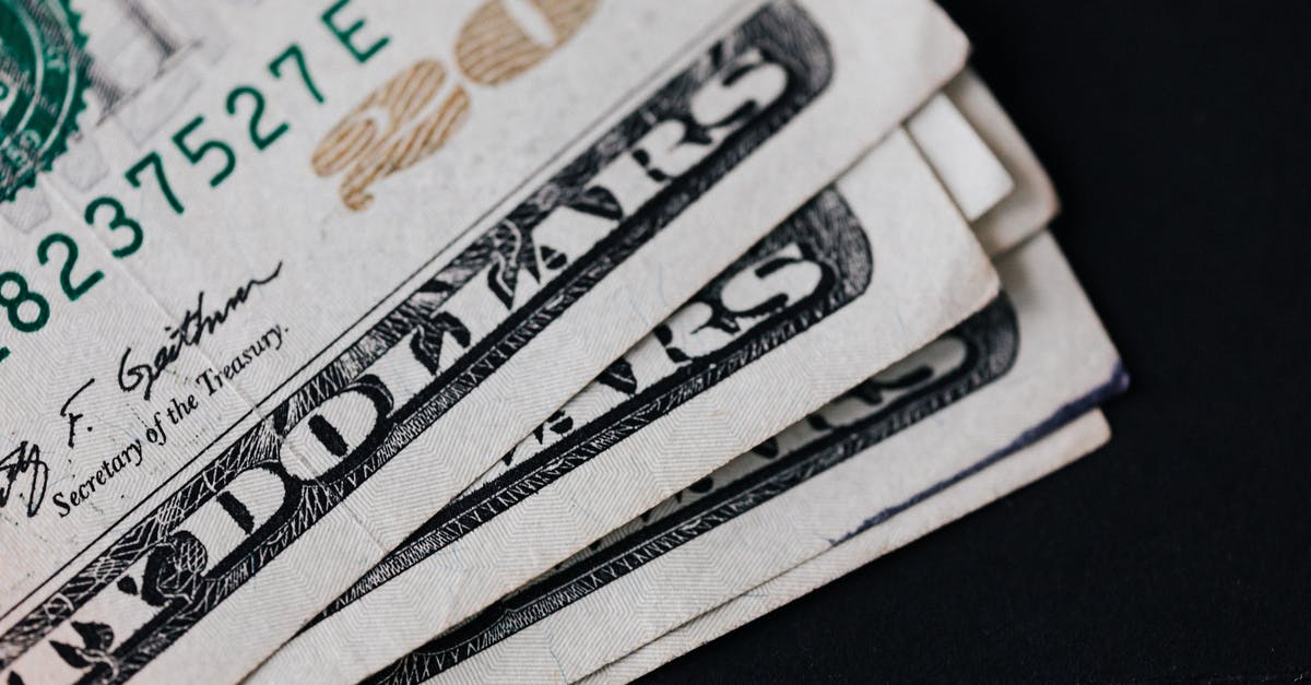 More than 20 provinces as a republic? - Pile of American paper money on black surface More than 20 provinces as a republic? - Pile of American paper money on black surface