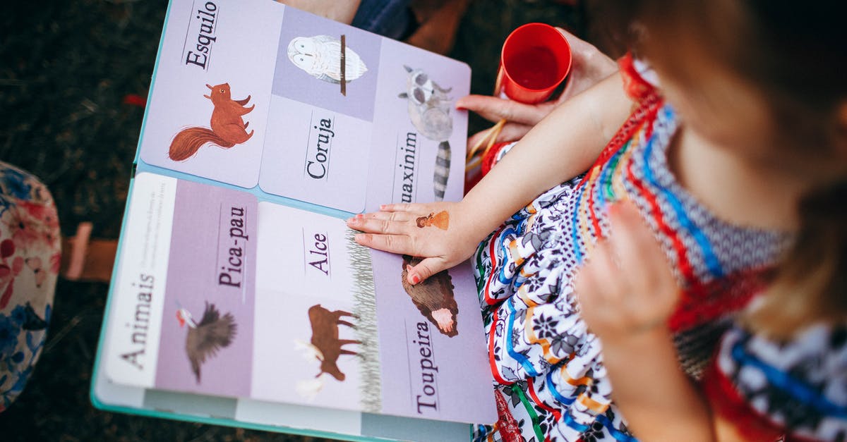 Mother Base/FOB: Can I climb onto a pipe from the top? - Child reading book with mother in garden Mother Base/FOB: Can I climb onto a pipe from the top? - Child reading book with mother in garden