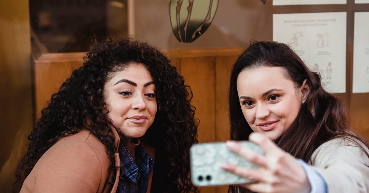 Mount and Blade Warband - How to capture a friendly town? - Smiling multiracial women taking selfie near building Mount and Blade Warband - How to capture a friendly town? - Smiling multiracial women taking selfie near building