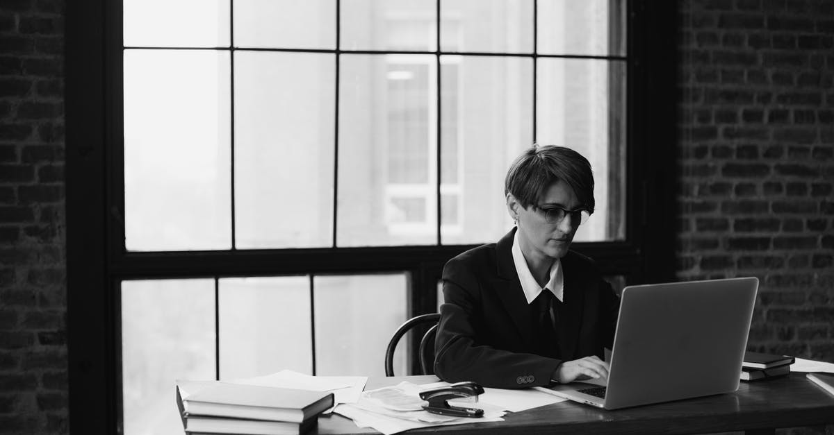 msi GE72 2QF Apache Pro, Windows 10 laptop - Grayscale Photo of Man in Black Suit Jacket Sitting on Chair in Front of Laptop Computer msi GE72 2QF Apache Pro, Windows 10 laptop - Grayscale Photo of Man in Black Suit Jacket Sitting on Chair in Front of Laptop Computer