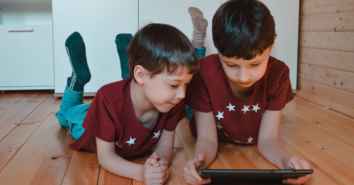 Multiple multiplayer games have the same connection issue - Cute siblings using tablet together at home