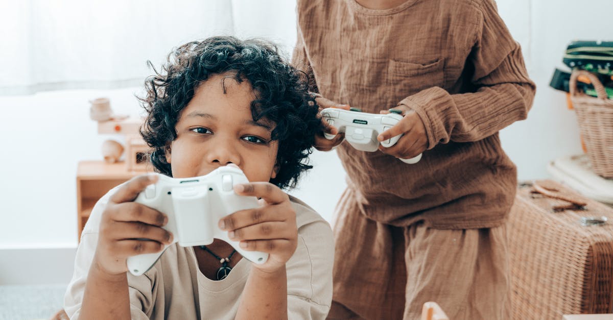 Multiple multiplayer games have the same connection issue - Happy ethnic kids playing on game console in living room