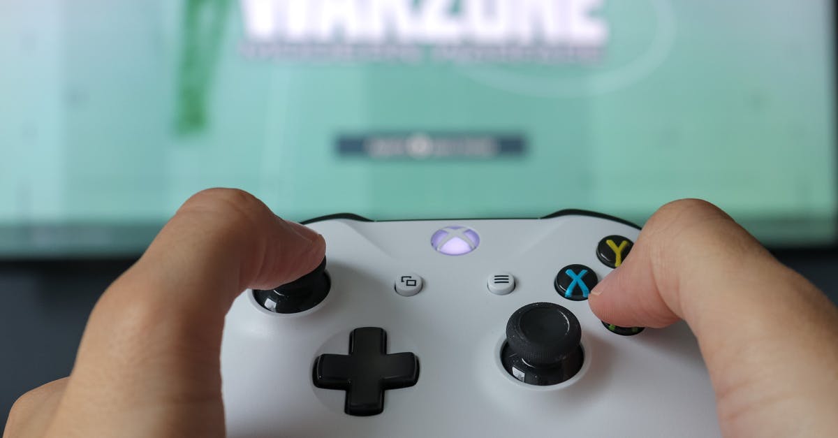 Multiple players on Xbox Minecraft Online game when only one has Xbox Live? - Close-Up Photo Of Game Controller