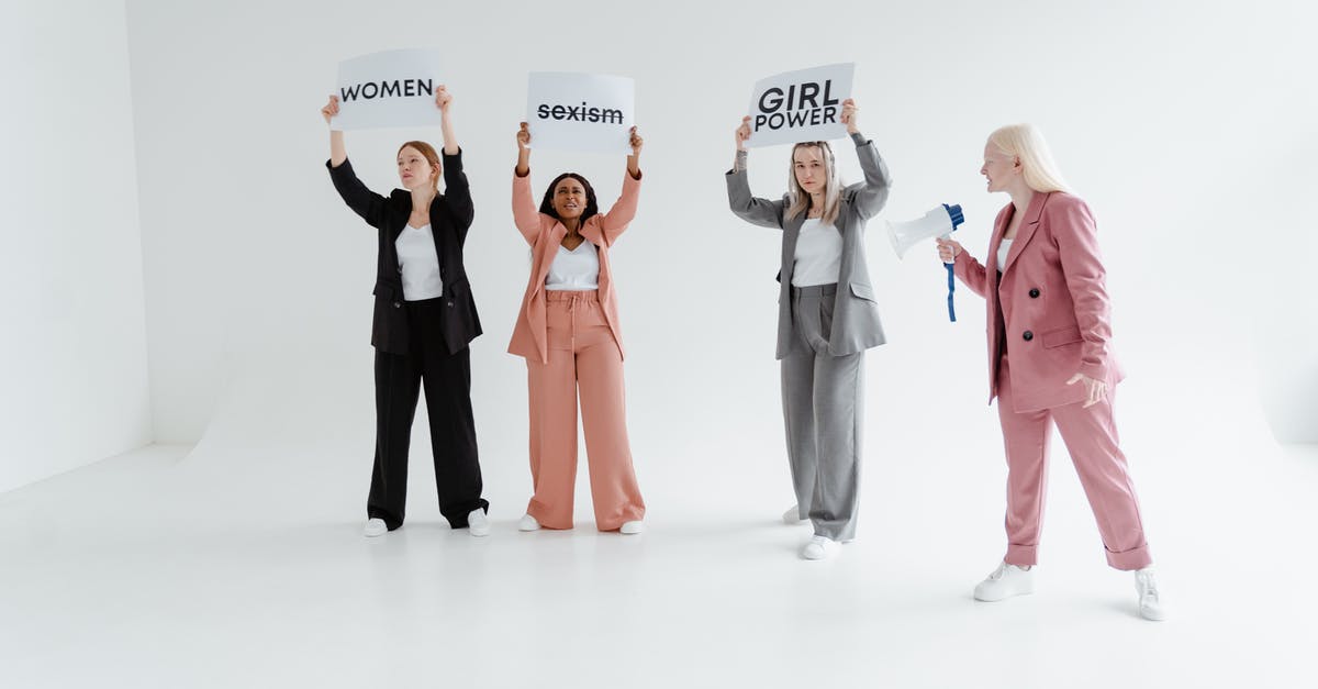 Multiple subfaction leaders - Women in Blazer and Pants Standing while Protesting Multiple subfaction leaders - Women in Blazer and Pants Standing while Protesting