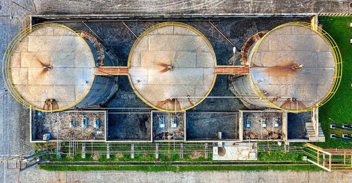 My cocaine refinery can't produce output because my storage is always full of weed. What should I do? - Round metal cylindrical containers at factory