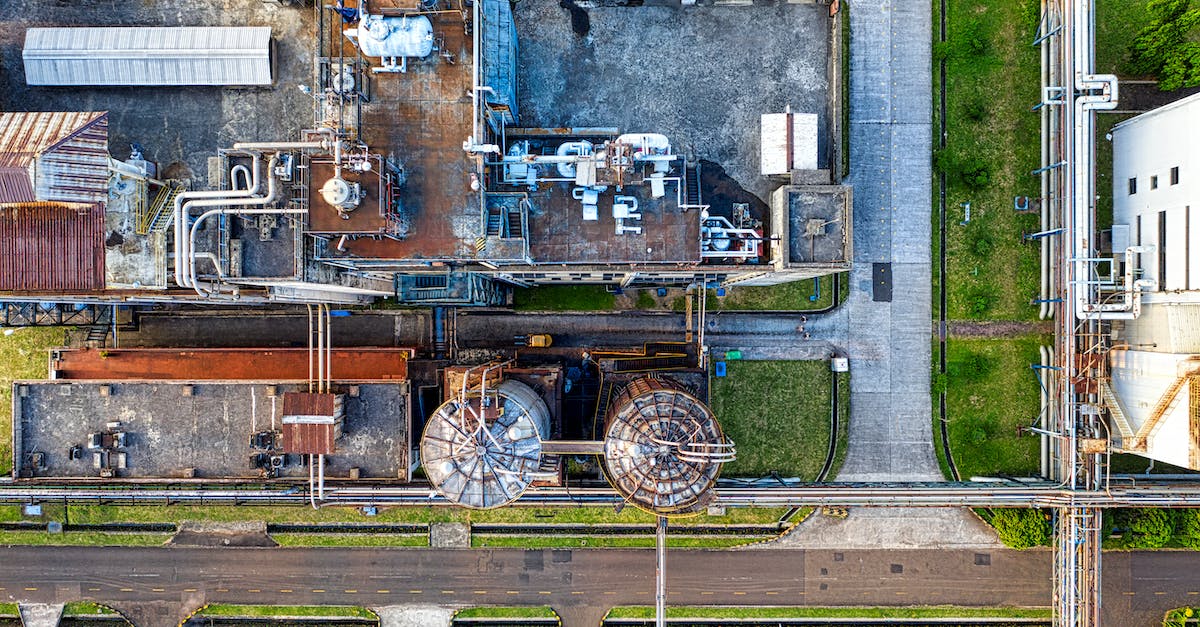 My cocaine refinery can't produce output because my storage is always full of weed. What should I do? - Aerial view of industrial complex consisting of tanks and pipes for producing petroleum products