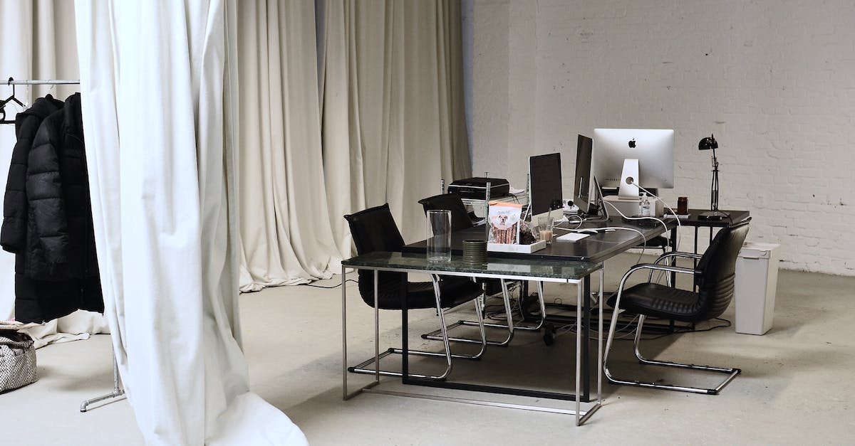 My computer says my USB stick containing my borderlands character is empty [duplicate] - Interior of conference room with modern personal computers placed on table with clothes hanging on rail