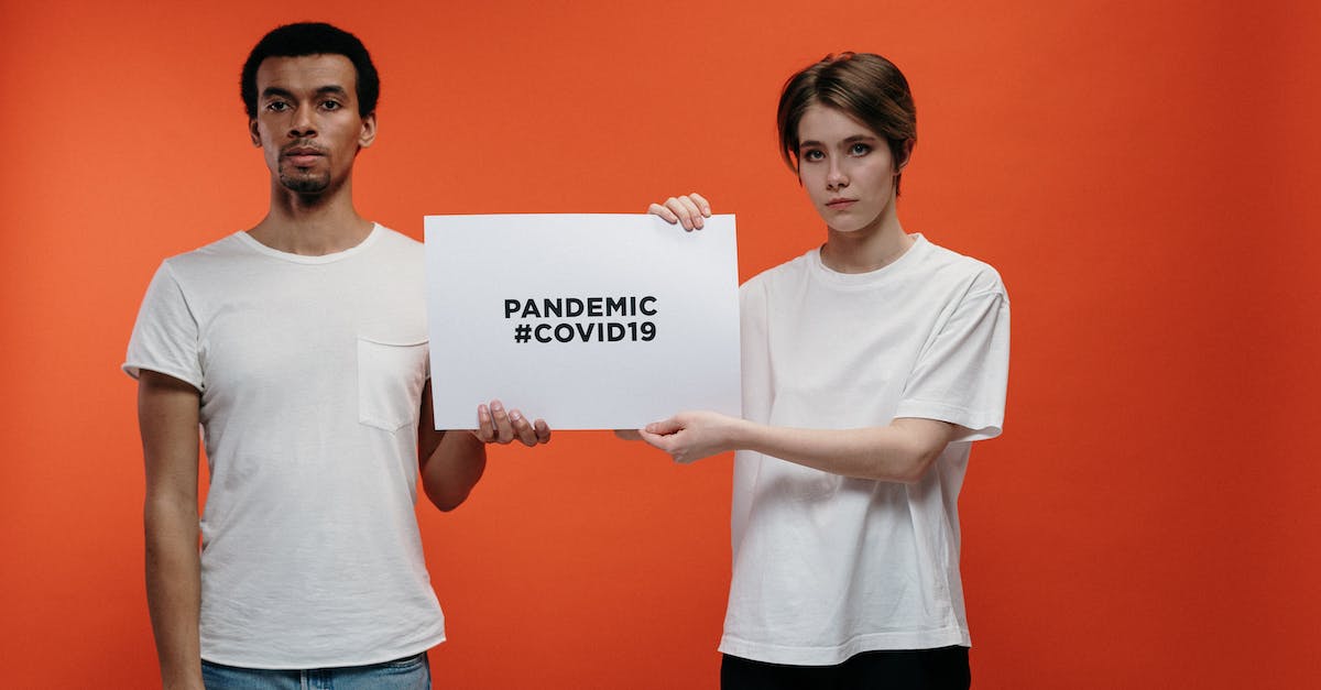 My DSi goes blank after the health and safety message - How can I fix it? - People Holding A Placard With Pandemic Covid19 Text