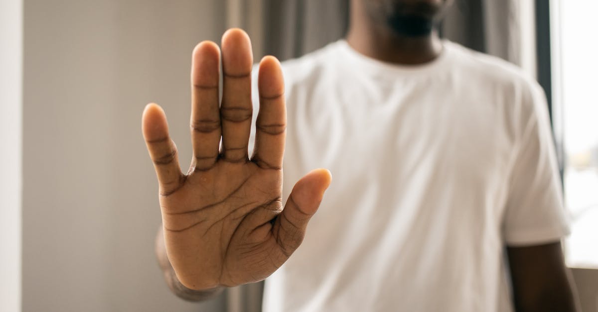 My followers won't stop attacking my horse! - Unrecognizable black man showing stop gesture