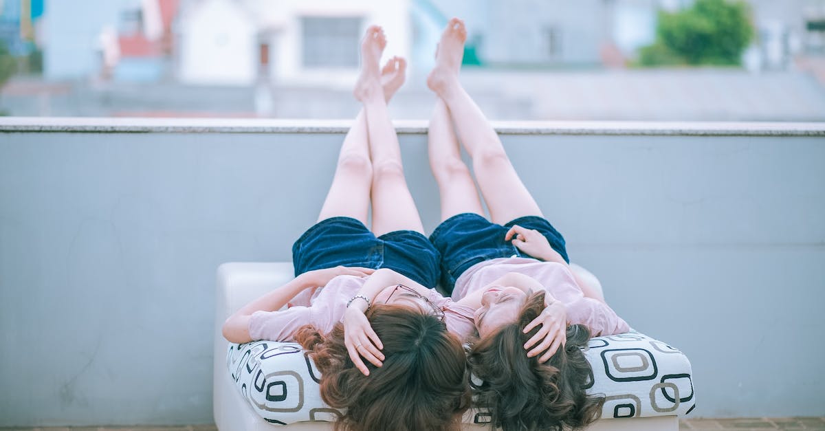 my NPC's are living in the wrong houses [duplicate] - Two Woman Wearing Pink Shirt and Blue Shorts Lying on Sofa Facing Each Other While Both Feet Crossed and Placed on Concrete Wall