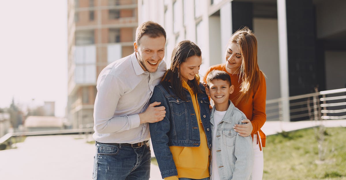 My only son is the heir to a city, so my titles will be inherited by my daughter. How to fix this? - Delighted family in trendy casual wear holding each other and standing near modern building on city street while walking together during weekend My only son is the heir to a city, so my titles will be inherited by my daughter. How to fix this? - Delighted family in trendy casual wear holding each other and standing near modern building on city street while walking together during weekend