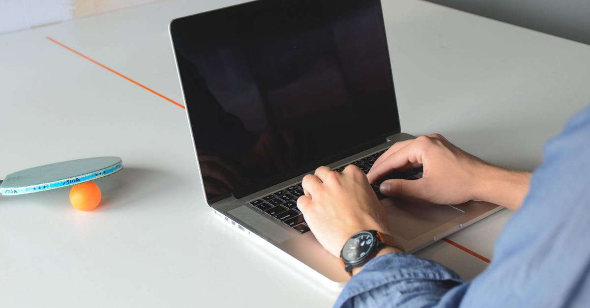 my PC controller is not working only for 1 game - Person Hands Lying on Macbook Pro on White Table