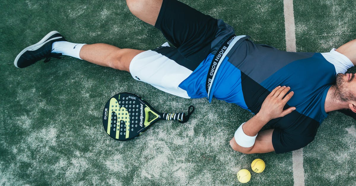 My player - View roster? - Man Lying Beside on Green Tennis Balls