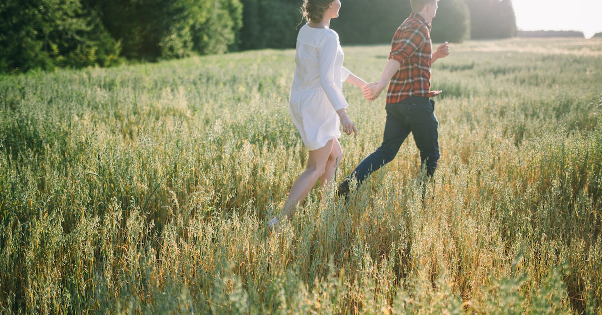 My shift key toggles running instead of hold to run, how to fix it? - Man in White Shirt Holding Woman in White Dress on Green Grass Field