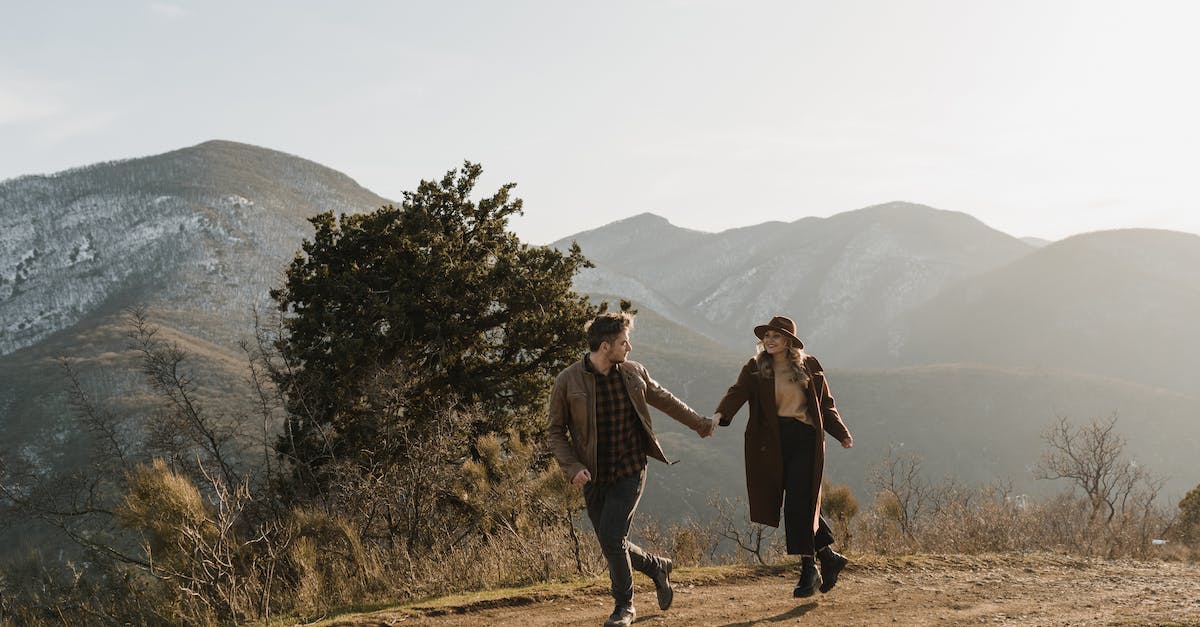 My shift key toggles running instead of hold to run, how to fix it? - Man and Woman Standing on Brown Dirt Road Near Green Trees