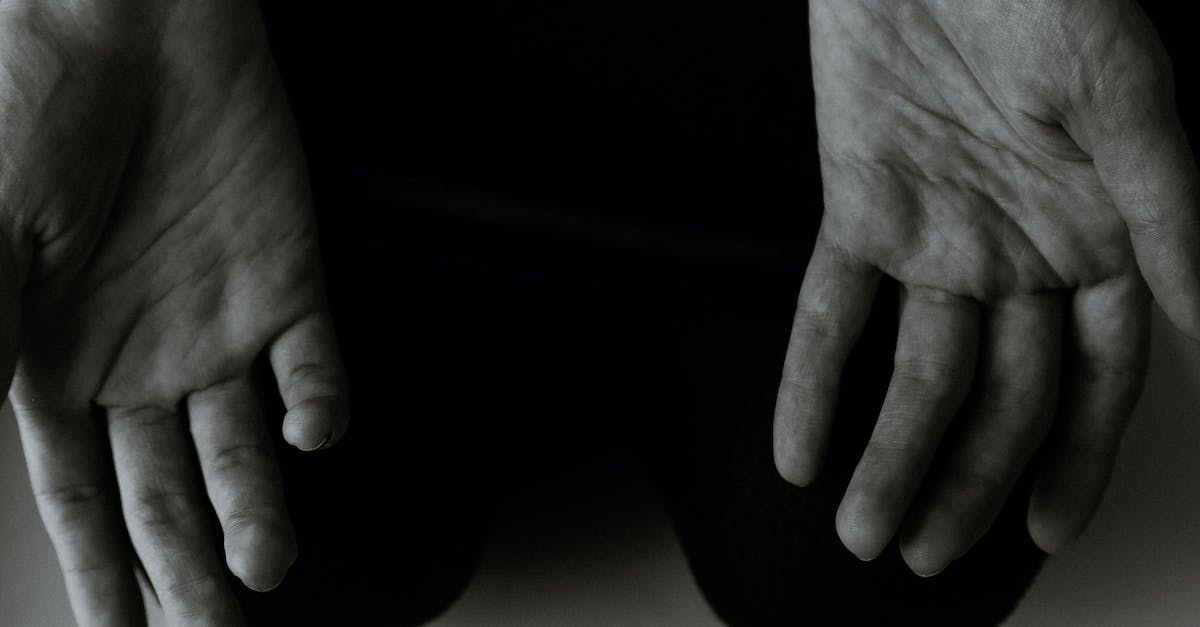 My skin will not show up on my character, what should I do? - From above black and white of crop anonymous person showing lines on palms of hands